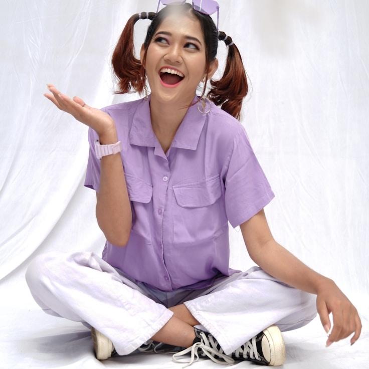 Ava Singh, Lead Design Curator at Steady Motion Project, reviewing corporate floral arrangements